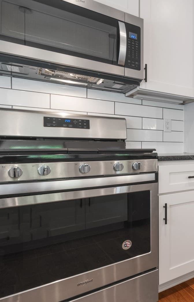 Indoor stainless gas range and oven in a residential kitchen